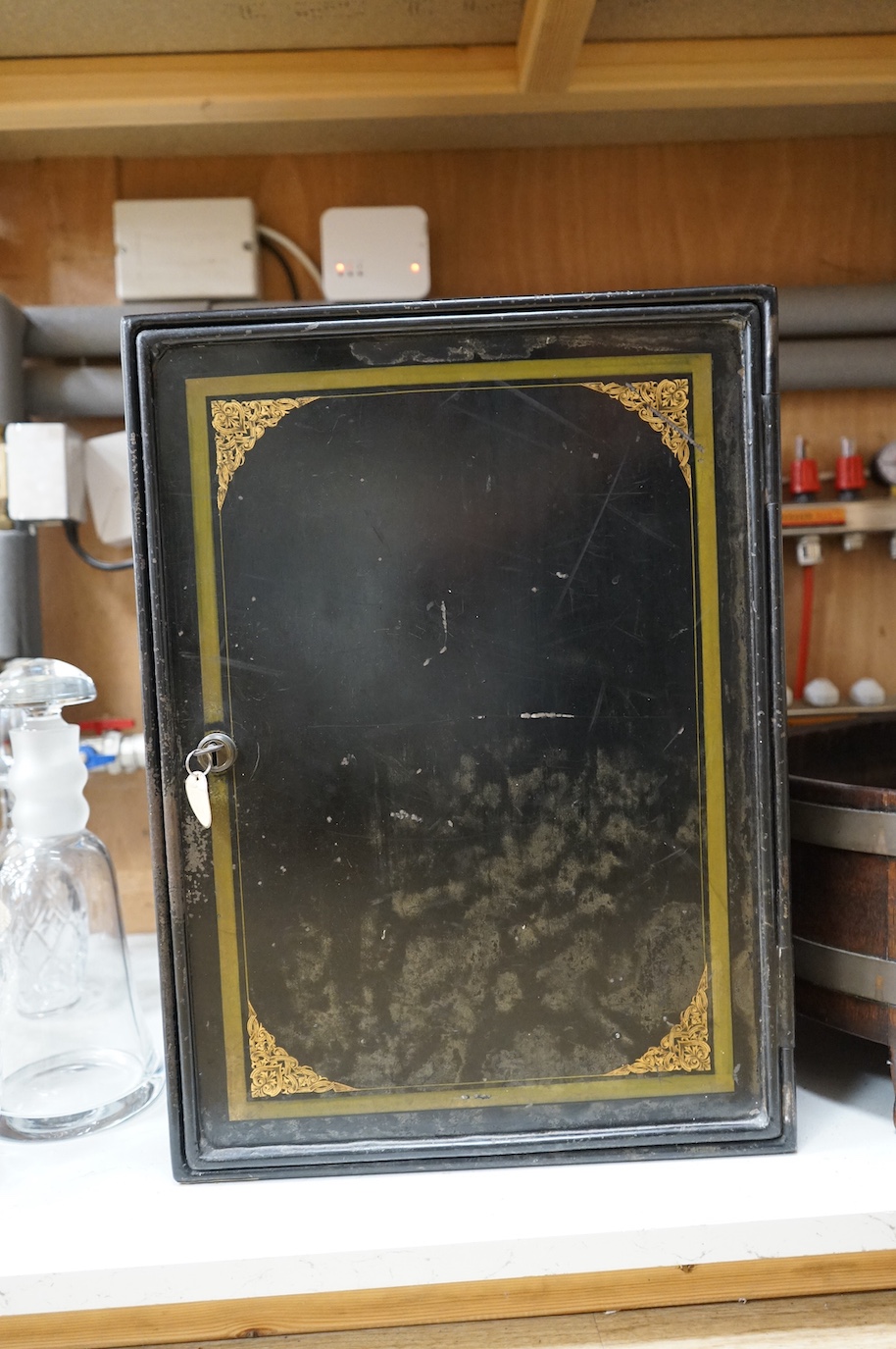 A staved oak jardiniere and a toleware safe with key, largest 52cm high
